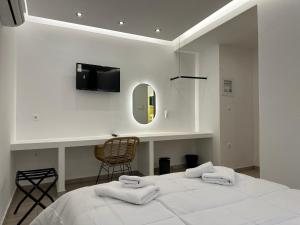 Postel nebo postele na pokoji v ubytování Olympian Altis Hotel