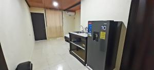 an empty room with a sink and a machine at Natural Manzanillo in Manzanillo