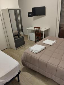 Giường trong phòng chung tại Affittacamere "Al Gebbione"