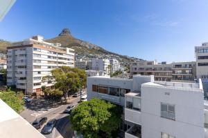 an aerial view of a city with a mountain at The Tropicana Hotel in Cape Town