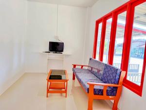 a living room with a couch and a table at The An Ant บ้านพัก&โฮมสเตย์ in Sam Roi Yot