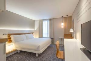 A bed or beds in a room at The Morrison Dublin, Curio Collection by Hilton