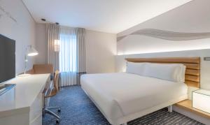 A bed or beds in a room at The Morrison Dublin, Curio Collection by Hilton