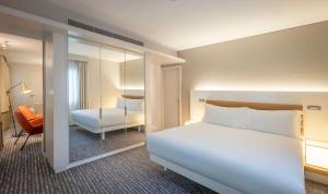A bed or beds in a room at The Morrison Dublin, Curio Collection by Hilton