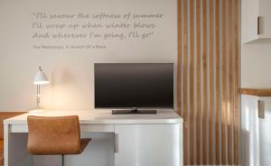 A television and/or entertainment centre at The Morrison Dublin, Curio Collection by Hilton