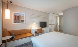 A television and/or entertainment centre at The Morrison Dublin, Curio Collection by Hilton