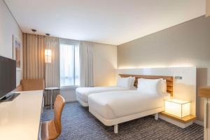 A bed or beds in a room at The Morrison Dublin, Curio Collection by Hilton
