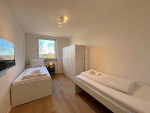 Ένα ή περισσότερα κρεβάτια σε δωμάτιο στο GuestHouse Bielefeld
