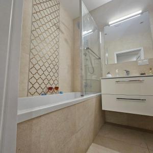 Kúpeľňa v ubytovaní Apartament Tęczowy