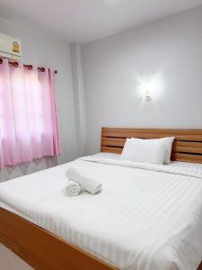 Postel nebo postele na pokoji v ubytování The An Ant บ้านพัก&โฮมสเตย์