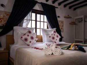 Postel nebo postele na pokoji v ubytování Resort Hotel El Cortijo & Spa