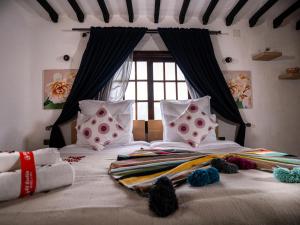 Postel nebo postele na pokoji v ubytování Resort Hotel El Cortijo & Spa