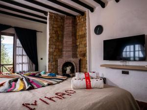 Postel nebo postele na pokoji v ubytování Resort Hotel El Cortijo & Spa
