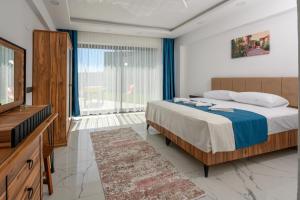 Postel nebo postele na pokoji v ubytování Villa Arna ELİTE + 23 fotografií