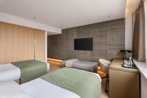 TV a/nebo společenská místnost v ubytování Royal Garden Hotel
