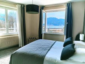 Postel nebo postele na pokoji v ubytování Hôtel La Réserve