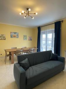 a living room with a couch and a table at Sicily Holiday Home in Termini Imerese