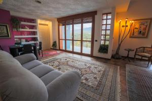 a living room with a white couch and a table at A Casa di Sara in Castrovillari +27 photos