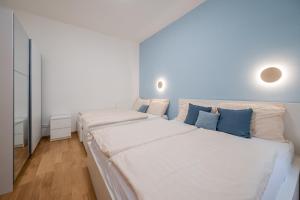 Posteľ alebo postele v izbe v ubytovaní Seifertova Apartments by Willstay