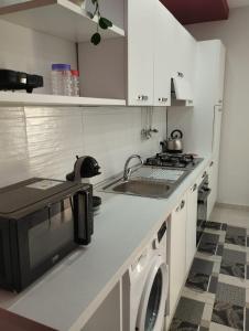 Kuchyň nebo kuchyňský kout v ubytování Casa Orchidea Mazzeo