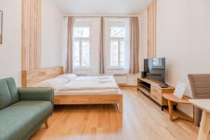 Posteľ alebo postele v izbe v ubytovaní Seifertova Apartments by Willstay