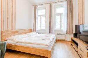 Posteľ alebo postele v izbe v ubytovaní Seifertova Apartments by Willstay