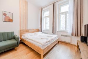 Posteľ alebo postele v izbe v ubytovaní Seifertova Apartments by Willstay