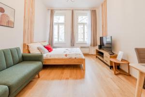 Televízia a/alebo spoločenská miestnosť v ubytovaní Seifertova Apartments by Willstay