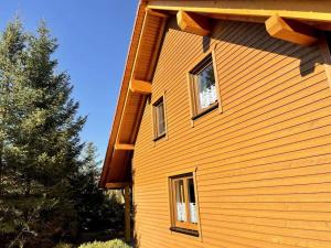 a house with three windows on the side of it at Ferienhaus Christel in Hasselfelde