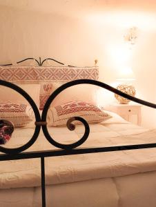 a bedroom with a bed with a metal frame at Villa Anna 300 m dal mare in Torre delle Stelle +56 photos