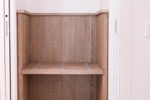 a closet with a wooden shelf in a room at Suite Alpina, profumo di legno e relax totale in Maso +7 photos