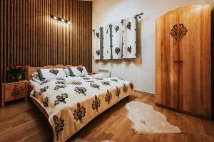 Posteľ alebo postele v izbe v ubytovaní VisitZakopane Apartament Limba