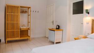 a bedroom with a bed and a telephone in it at Golden Lighthouse Hotel in Patara