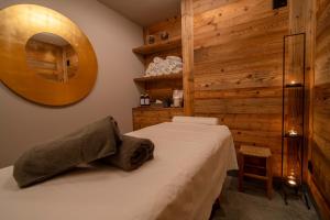 Postel nebo postele na pokoji v ubytování Hotel Alù Mountain Design