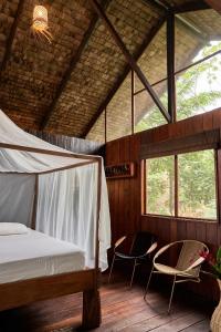 Postel nebo postele na pokoji v ubytování Jardín Botánico del Pacífico y Mecana Ecohotel