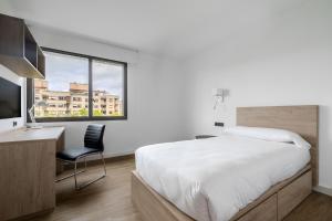 Postel nebo postele na pokoji v ubytování Micampus Pamplona Student Residence + 16 fotografií