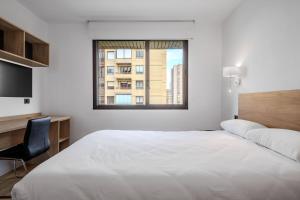 Postel nebo postele na pokoji v ubytování Micampus Pamplona Student Residence