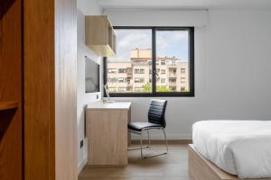 TV a/nebo společenská místnost v ubytování Micampus Pamplona Student Residence