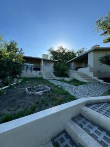 a view of a building with stairs and a yard at Cabañas Cuesta in Cordoba