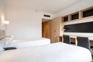 Postel nebo postele na pokoji v ubytování Micampus Pamplona Student Residence