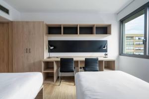 Postel nebo postele na pokoji v ubytování Micampus Pamplona Student Residence