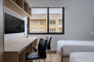 Postel nebo postele na pokoji v ubytování Micampus Pamplona Student Residence