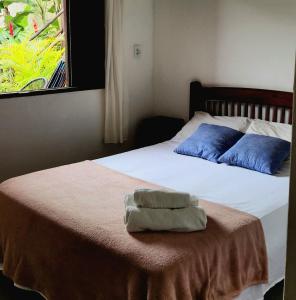 Cama ou camas em um quarto em Pousada Pitaya Maresias