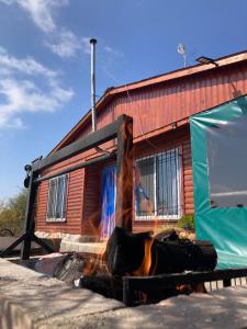 a house with a fire in front of it at La Lugarda in Cuesta Blanca