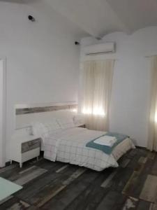Postel nebo postele na pokoji v ubytování Modernos Apartamentos en Ciudad Jardín Córdoba