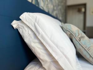 A bed or beds in a room at Porta alla Croce Guest House