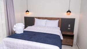 Postel nebo postele na pokoji v ubytování Hotel Boutique Nueva Valladolid