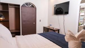 Postel nebo postele na pokoji v ubytování Hotel Boutique Nueva Valladolid