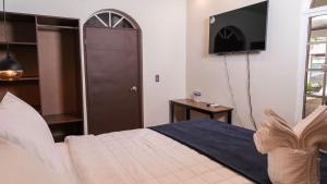 Postel nebo postele na pokoji v ubytování Hotel Boutique Nueva Valladolid