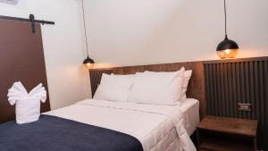 Postel nebo postele na pokoji v ubytování Hotel Boutique Nueva Valladolid